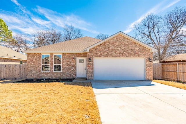 ranch-style home featuring driveway, brick siding, an attached garage, and fence