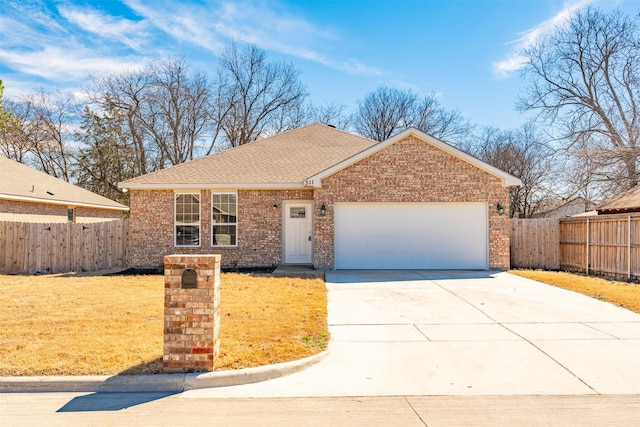 ranch-style house with an attached garage, fence, concrete driveway, and brick siding