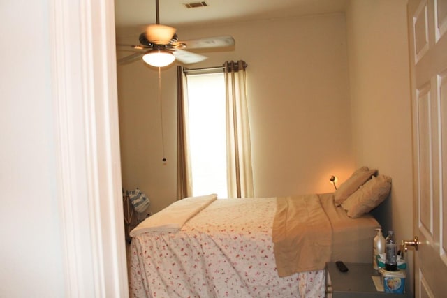 bedroom featuring ceiling fan and visible vents