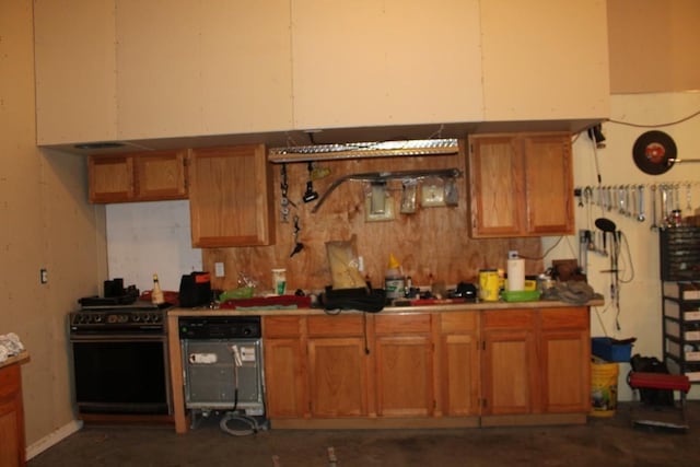 kitchen with brown cabinetry and stainless steel range