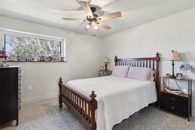 bedroom featuring ceiling fan and baseboards