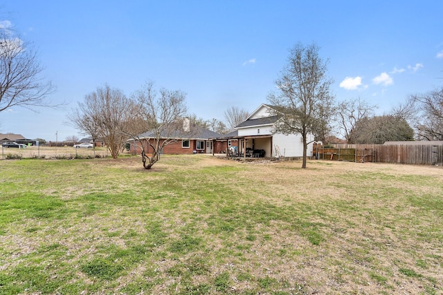 view of yard featuring a patio and a fenced backyard