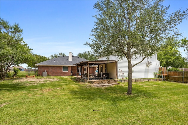 230 Holder Trl, Mckinney, TX 75071 - back of property featuring a patio area, brick siding, and a chimney