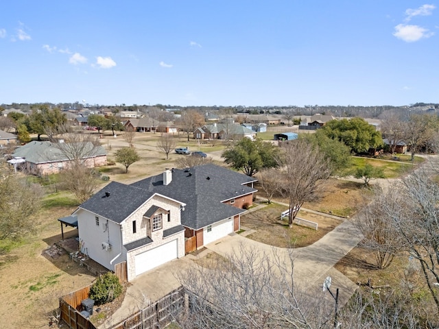 birds eye view of property with a residential view