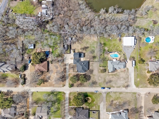 bird's eye view featuring a water view and a residential view