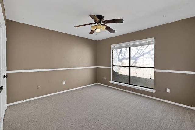 unfurnished room with ceiling fan, carpet, and baseboards