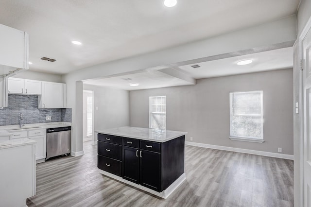 138 Whippoorwill Dr, Dallas, TX 75224 - kitchen featuring stainless steel dishwasher, dark cabinets, a sink, white cabinets, and recessed lighting