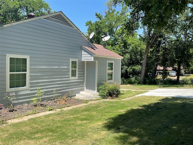 138 Whippoorwill Dr, Dallas, TX 75224 - back of property with a yard and a shingled roof