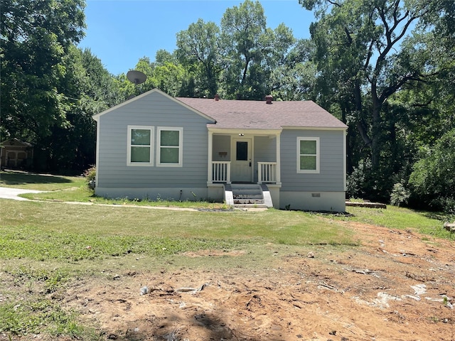138 Whippoorwill Dr, Dallas, TX 75224 - view of front facade featuring a porch, a front lawn, a shingled roof, and view of scattered trees