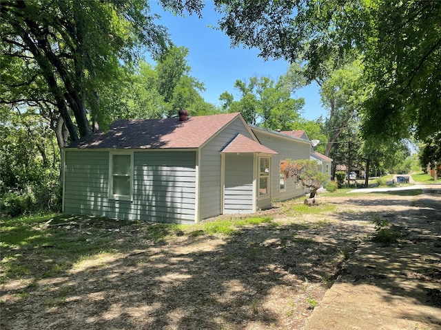 138 Whippoorwill Dr, Dallas, TX 75224 - view of property exterior with a shingled roof
