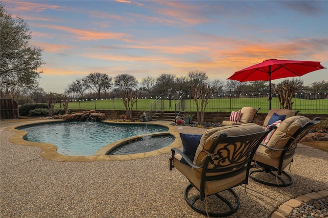 view of pool featuring a fenced in pool, a fenced backyard, and a patio