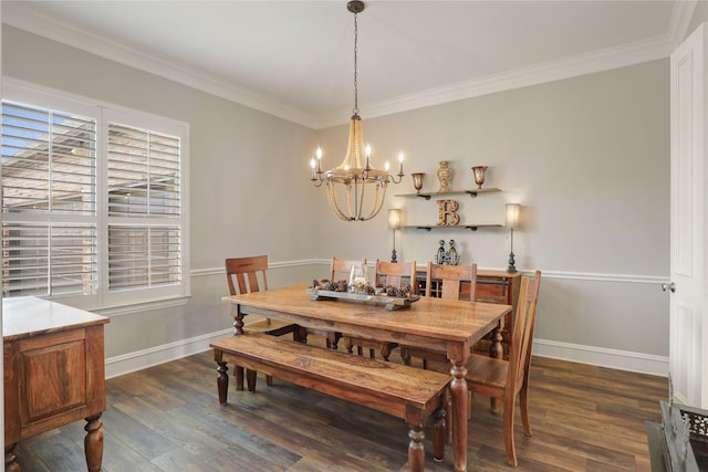 dining room featuring dark wood-type flooring, ornamental molding, and baseboards