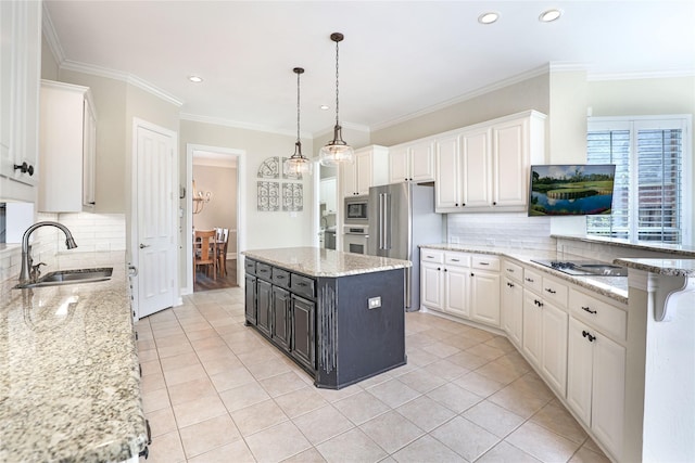 kitchen with light tile patterned floors, appliances with stainless steel finishes, white cabinets, and a sink