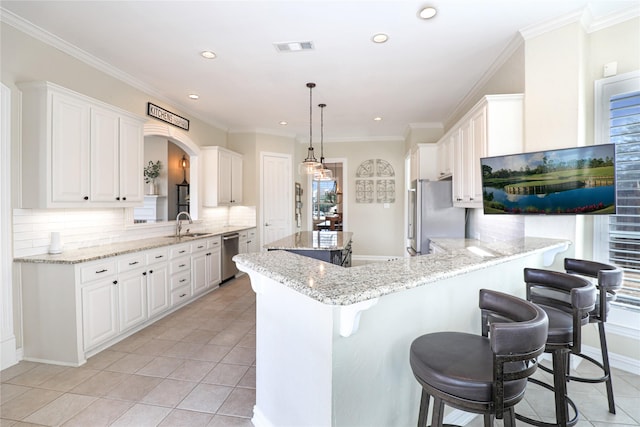 kitchen featuring light tile patterned floors, appliances with stainless steel finishes, a kitchen bar, and visible vents