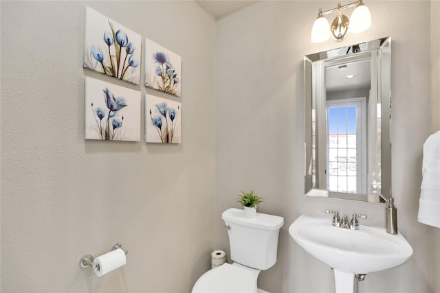 bathroom featuring a sink and toilet