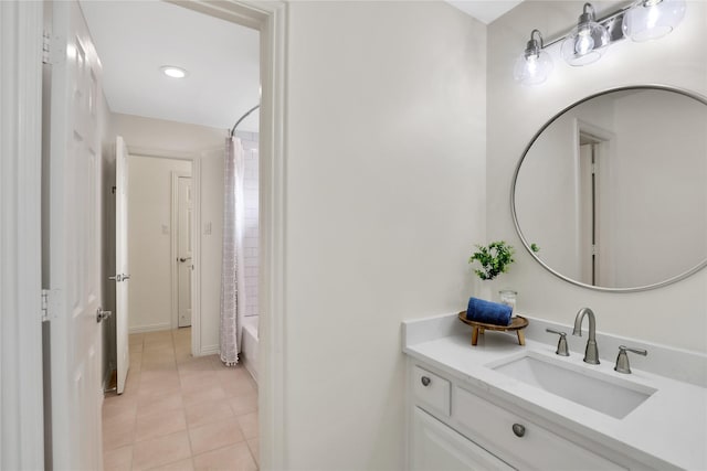 full bathroom featuring tile patterned floors, vanity, and shower / bath combo with shower curtain