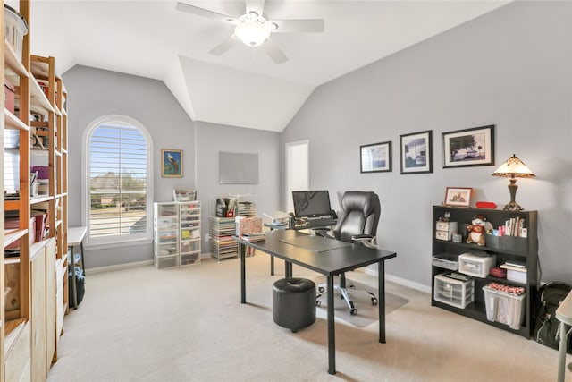 office area featuring carpet floors, vaulted ceiling, and a ceiling fan