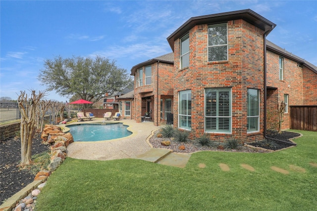 view of pool with a yard, a fenced in pool, a fenced backyard, and a patio