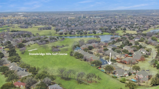 birds eye view of property with a residential view and a water view