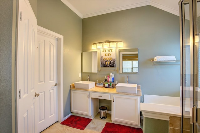 bathroom featuring crown molding, tile patterned floors, a sink, and double vanity