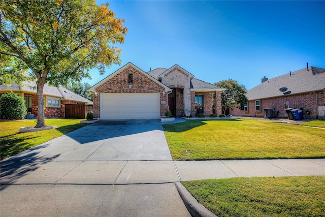 view of front of home with a garage, a front yard, concrete driveway, and brick siding