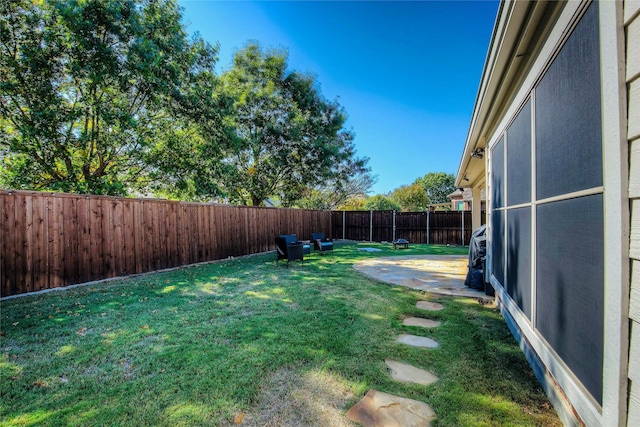 view of yard featuring a fenced backyard and a patio