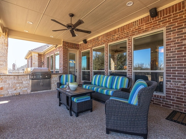 view of patio / terrace featuring an outdoor kitchen, a grill, outdoor lounge area, and ceiling fan