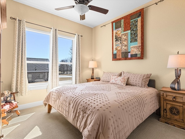 bedroom with carpet floors, ceiling fan, and baseboards