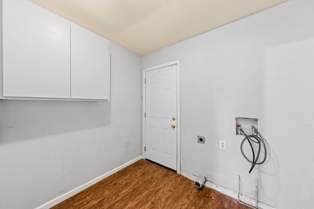 laundry area featuring washer hookup, cabinet space, hookup for an electric dryer, wood finished floors, and baseboards