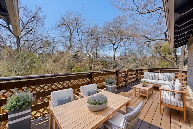 wooden terrace featuring outdoor dining space and an outdoor living space