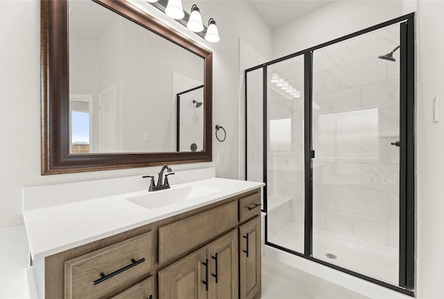 bathroom featuring vanity and a shower stall
