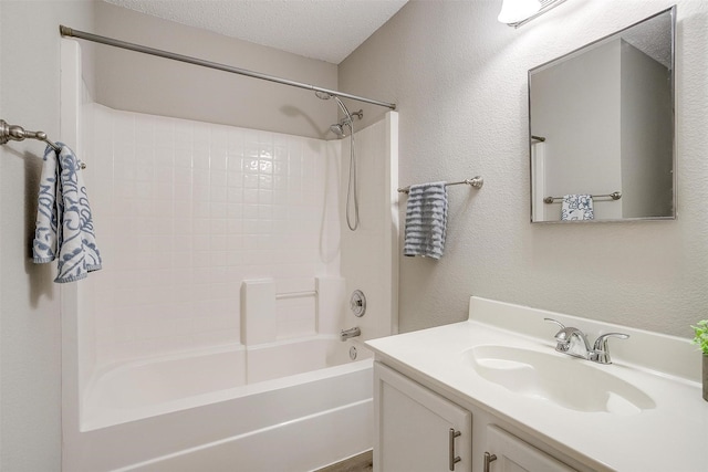 full bathroom with a textured wall, a textured ceiling, vanity, and bathing tub / shower combination