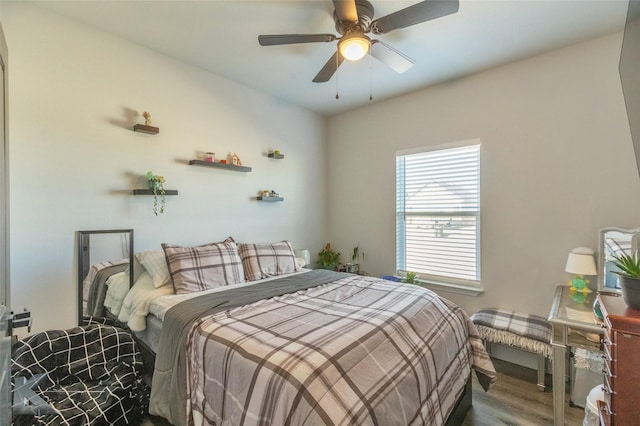 bedroom with ceiling fan and wood finished floors