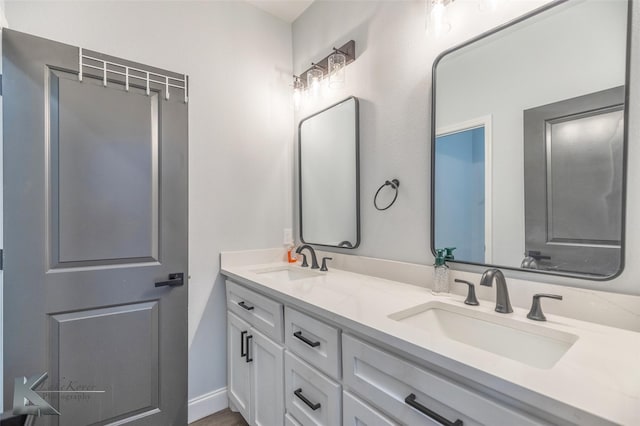 bathroom featuring double vanity and a sink