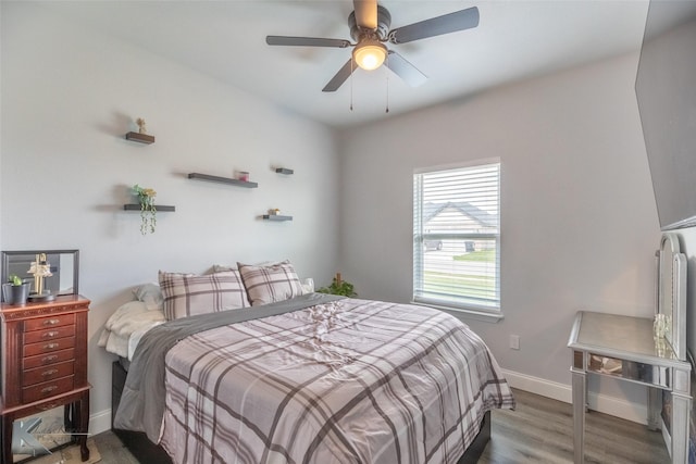 7001 Coldwater Dr, Abilene, TX 79601 - bedroom with wood finished floors, baseboards, and a ceiling fan