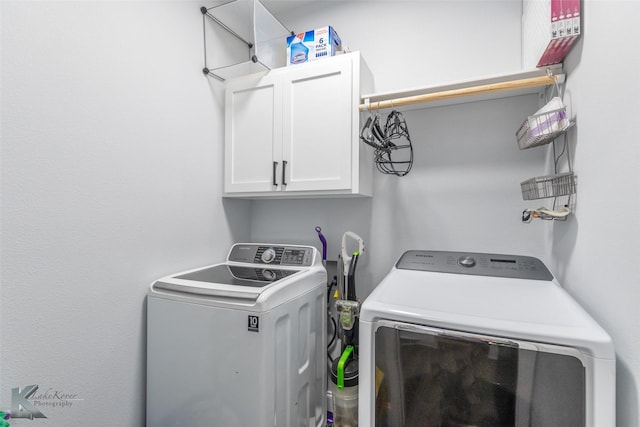 7001 Coldwater Dr, Abilene, TX 79601 - clothes washing area with washing machine and clothes dryer and cabinet space