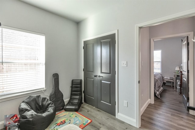 rec room with light wood finished floors and baseboards