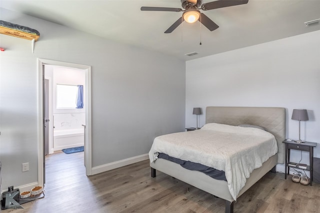 7001 Coldwater Dr, Abilene, TX 79601 - bedroom with wood finished floors, baseboards, a ceiling fan, and ensuite bath
