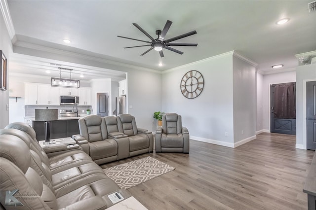 7001 Coldwater Dr, Abilene, TX 79601 - living area with a ceiling fan, light wood-style floors, recessed lighting, baseboards, and crown molding
