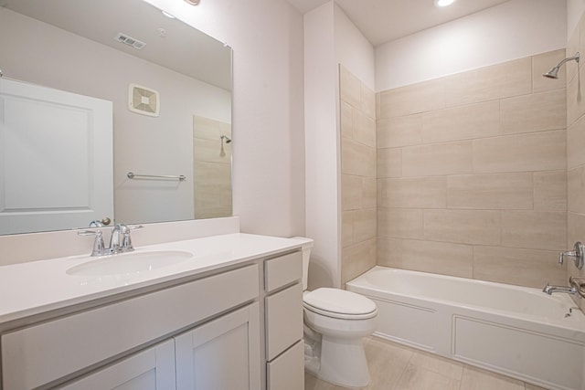 bathroom with visible vents, shower / bath combination, vanity, and toilet