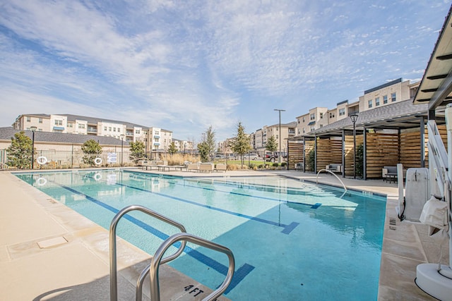 community pool featuring fence