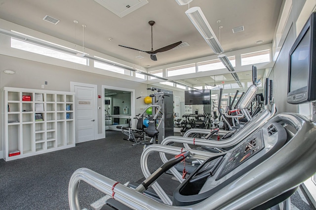 gym featuring ceiling fan and visible vents