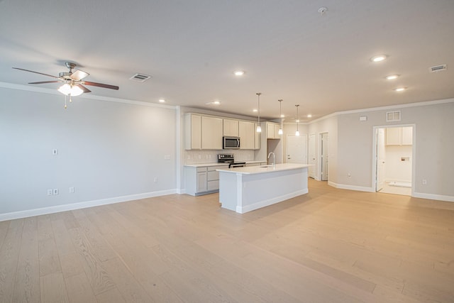 kitchen with stainless steel appliances, visible vents, open floor plan, light countertops, and pendant lighting