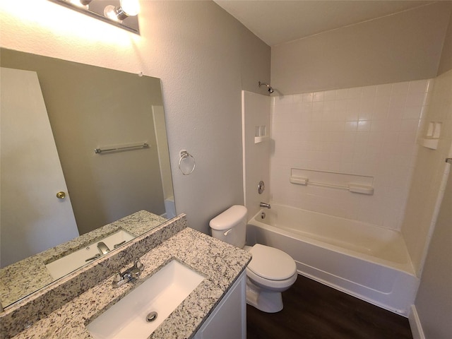 full bathroom featuring shower / bath combination, vanity, toilet, and wood finished floors