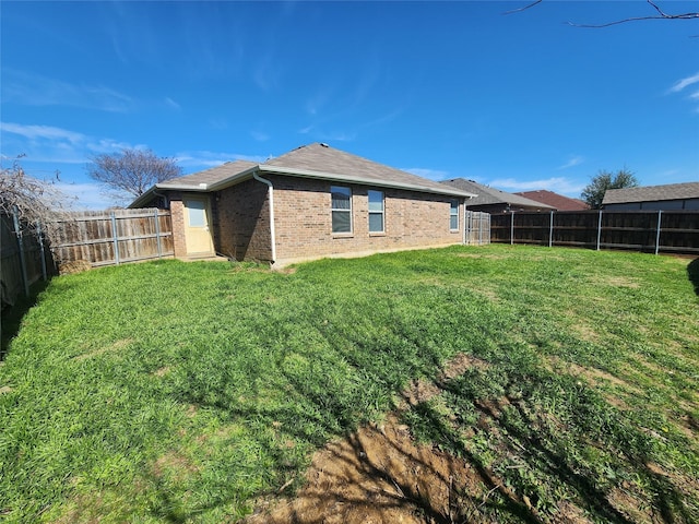 view of yard with a fenced backyard