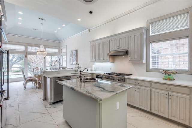 kitchen featuring under cabinet range hood, appliances with stainless steel finishes, marble finish floor, and crown molding