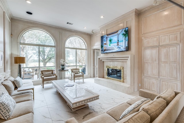 living area with recessed lighting, a fireplace, visible vents, marble finish floor, and crown molding