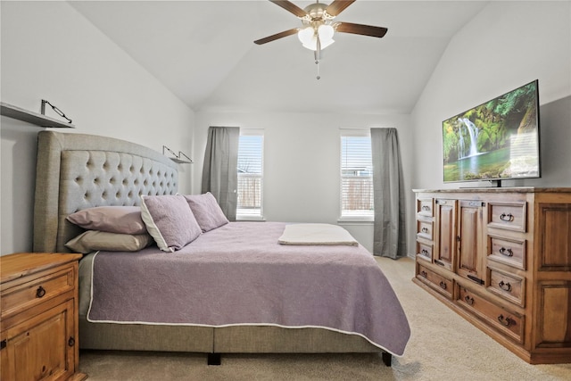 bedroom with light carpet, ceiling fan, and vaulted ceiling