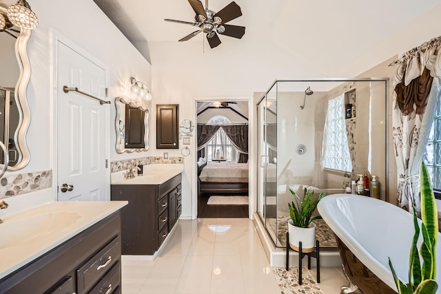 4212 Honeysuckle Dr, Mckinney, TX 75070 - bathroom with two vanities, a ceiling fan, a shower stall, healthy amount of natural light, and lofted ceiling