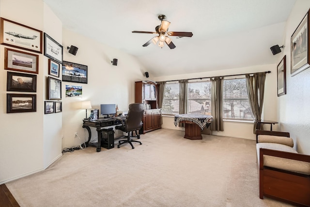 office featuring lofted ceiling, light colored carpet, and ceiling fan